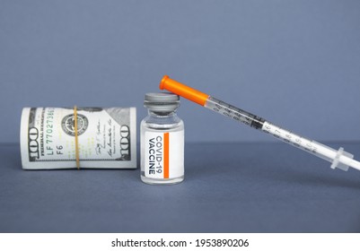 Syringe And Vaccine Ampoule, American Dollar Money Banknotes,  Coronavirus Pandemic, Vaccine Availability In Rich And Poor Countries. Sale Of Medicines.