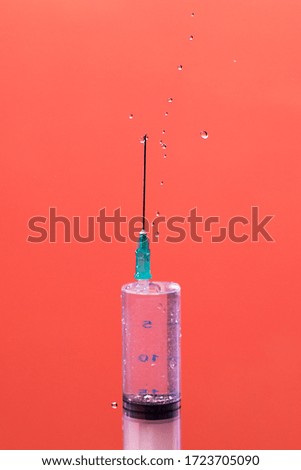 Similar – Medical syringe on colorful background.