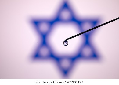 Syringe Or Vaccine With Israel Flag In Background.