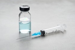Syringe And Vial On Grey Table. Medical Anesthesia