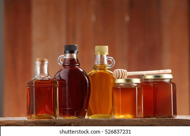 syrup and honey on the wooden background