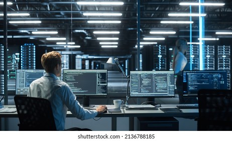 System Administration and Machine Learning Engineer Programming at His Workstation. Man Plans and Carries Out Work to Expand the Network Structure of the Enterprise at His Office