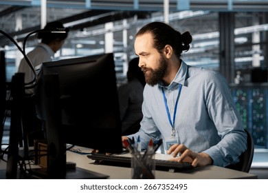 System administrator in data center doing software updates, verifying neural network parameters. Server hub IT expert using PC to inspect configurations, ensuring optimal application performance