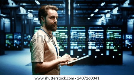 System administrator doing checkup on VPN servers with top security standards used to adequately protect sensitive data. High tech facility providing secure internet connections for clients