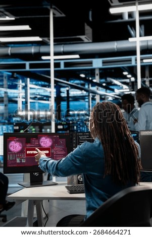 System administrator in server hub trying to protect hardware from hacker attack stealing sensitive information. Data center cybersecurity specialist fighting virus during security breach