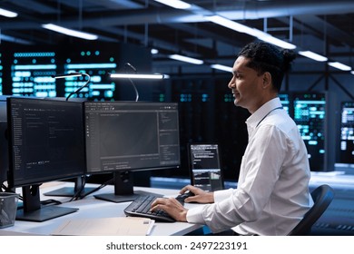 System administrator troubleshooting hardware and software errors in server farm. IT staff member maintaining mainframes network infrastructure in data center, coding on PC