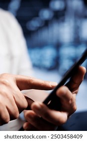 System administrator using tablet in high tech workplace, installing dedicated VPN servers able to provide encrypted sensitive data, online anonymity and fast speed bandwidth to customers, close up