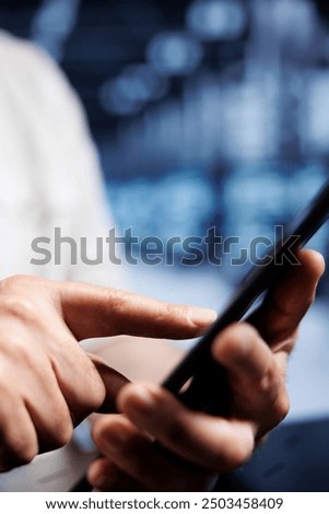 System administrator using tablet in high tech workplace, installing dedicated VPN servers able to provide encrypted sensitive data, online anonymity and fast speed bandwidth to customers, close up