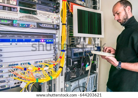 system administrator works server room data stock photo edit now computer systems administrator
