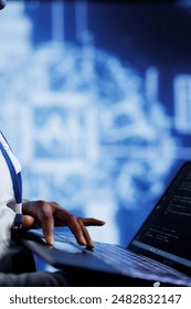 System administrator writes code on laptop to visualize artificial intelligence neural networks using augmented reality, close up. High tech facility worker runs AI script for information processing