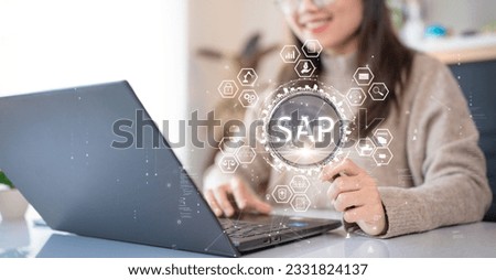 System Applications and Product (SAP). Program helps manage business to access information quickly accurately. Woman using laptop holding magnifying glass with SAP text inside. An icon on background.
