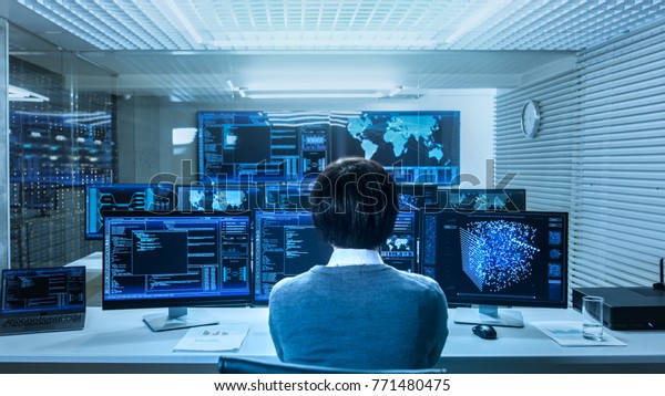 In\
the System Control Data Center Technician Operates Multiple Screens\
with Neural Network and Data Mining Activities. Room is Light and\
Full of Monitors with Working Neural Network on\
Them.