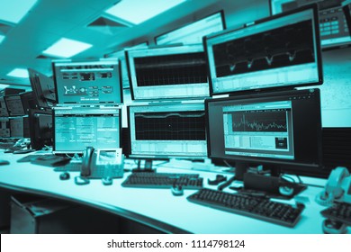 System Control Room IT with many monitor  in a High-Tech Facility That Works on the Surveillance, Neural Networks, Data Mining.