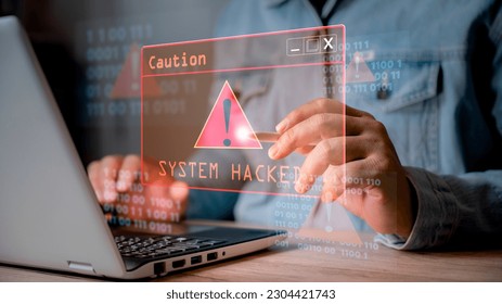 System hacked alert after cyber attack on computer network. user is using computer with triangle caution warning sign for notification error. cyber crime, cyber security, Ransomware, Phishing, Spyware