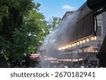 A system that cools the environment by spraying water in open-air cafe-type spaces.
