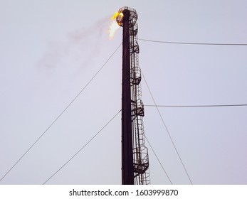 System Of A Torch On An Oil Field. Burning Through A Torch Head.