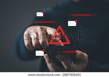 System warning alert on smartphone with phishing emails and security risk icons, user interacting with mobile device. Cybersecurity threat, data breach, spam detection and digital protection concept.