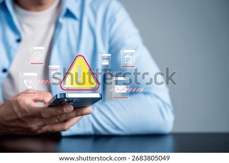 System warning and cybersecurity alert concept on smartphone. Digital risk management and data protection notification for online security, malware threat prevention, and network safety awareness.