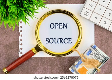 System and website builder concept. OPEN SOURCE through a magnifying glass on a white sheet of notepad.