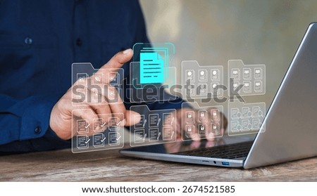 Systematic data storage, Folder hierarchy structure, Document management system DMS, Saving and classifying files, Digital file, Storage secure, Businessman selecting files on cloud and using laptop