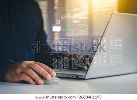 Systematic data storage, Folder hierarchy structure, Document management system DMS, Saving and classifying files, Digital file, Storage secure, Businessman selecting files on cloud and using laptop