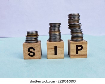 Systematic investment plan (SIP) concept on wooden blocks. 