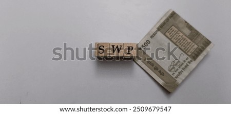 Systematic Withdrawal Plan (SWP) Concept On Wooden Blocks