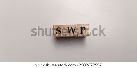 Systematic Withdrawal Plan (SWP) Concept On Wooden Blocks