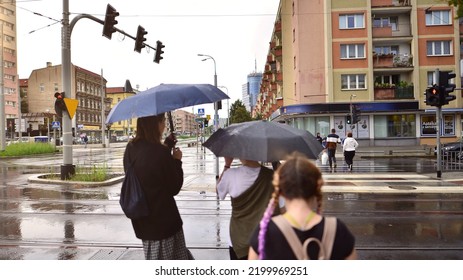 Szczecin, Poland. 29 August 2022. People With Umbrellas On A Rainy Day Outside