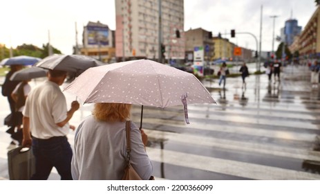 Szczecin, Poland. 29 August 2022. People With Umbrellas On A Rainy Day Outside