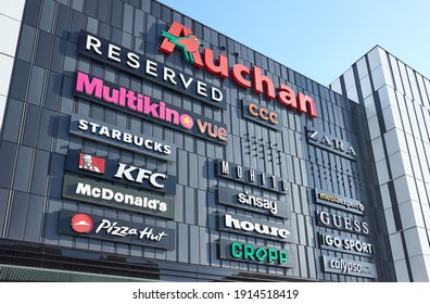 Szczecin, Poland - February 10, 2021: Brands And Logos On The Exterior Of GALAXY Shopping And Entertainment Center.