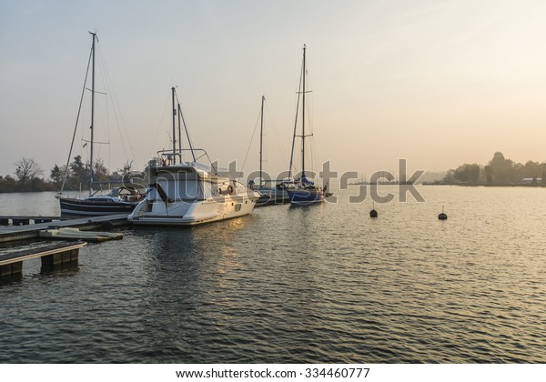 Szczecin, Poland -\
October 31, 2015: Motorboats and sailboats at the pier on the lake\
autumn season in\
Poland\
