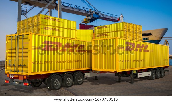 Szczecin,Poland-February 2020: with the DHL logo\
on the trucks at the container terminal in the\
port