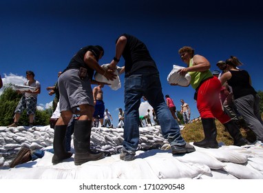 Szentendre, Hungary - June 20, 2013: 
Danube, Donau flood. Residents work together to protect the city by filling sandbags.