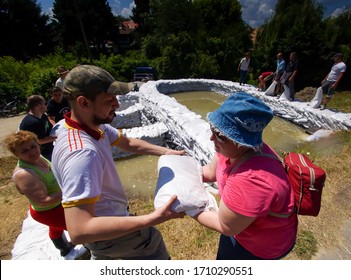 Szentendre, Hungary - June 20, 2013: 
Danube, Donau Flood. Residents Work Together To Protect The City By Filling Sandbags.