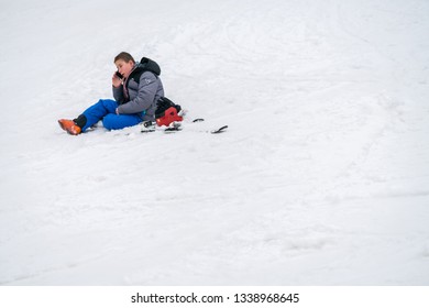 Szklarska Poreba, Poland - February 2019 : Young Boy Calling For Help On His Mobile Phone After Skiing Or Snowboarding Accident On The Mountain Slope, Szrenica Mountain, Karkonosze