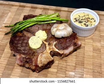 T Bone Steak With Asparagus And Truffle Butter And Cream Sauce