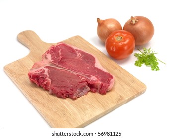 A T Bone Steak Isolated Against A White Background