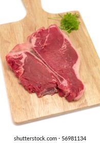 A T Bone Steak Isolated Against A White Background