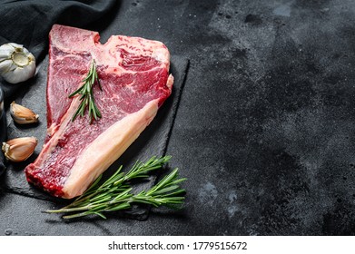 T bone steak. Organic raw Tbon beef. Black background. Top view. Copy space - Shutterstock ID 1779515672