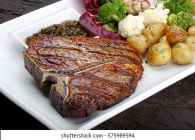 T Bone Steak With Potato Salad And Vegetables