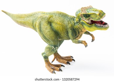 T rex figurine on white background