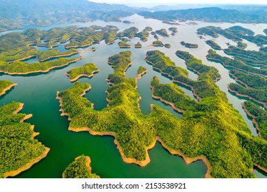 Ta Dung lake seen from above in the morning with small islands of paradise with beautiful abstract shapes. This is the reservoir for increase in Dac Nong, Vietnam.