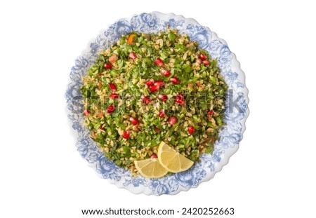 Tabbouleh salad is a traditional middle eastern or arab dish. Vegetarian salad with parsley, mint, bulgur, tomato. Turkish name; Tabule salatasi