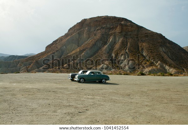 Tabernas, Almeria, Spain, august 14,\
2017. Vintage cars in Desert Tabernas.Tabernas desert in AlmeriaIt\
is a famous place to make movies and TV\
ads.