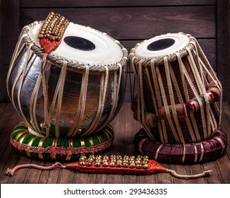 Tabla drums and bells for Indian dancing on wooden background 