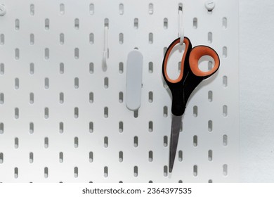 table of accessories with hanging scissors