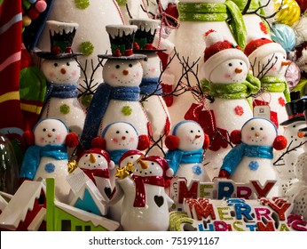 A table is adorned with vintage style snow man decorations at a local crafts fair.