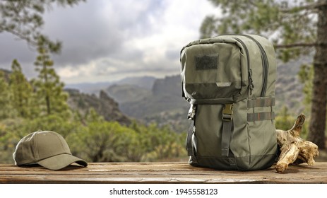 Table background of free space and backpack in forest. Spring trip time. 