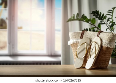 Table background of free space and blurred window background with sea landscape. 